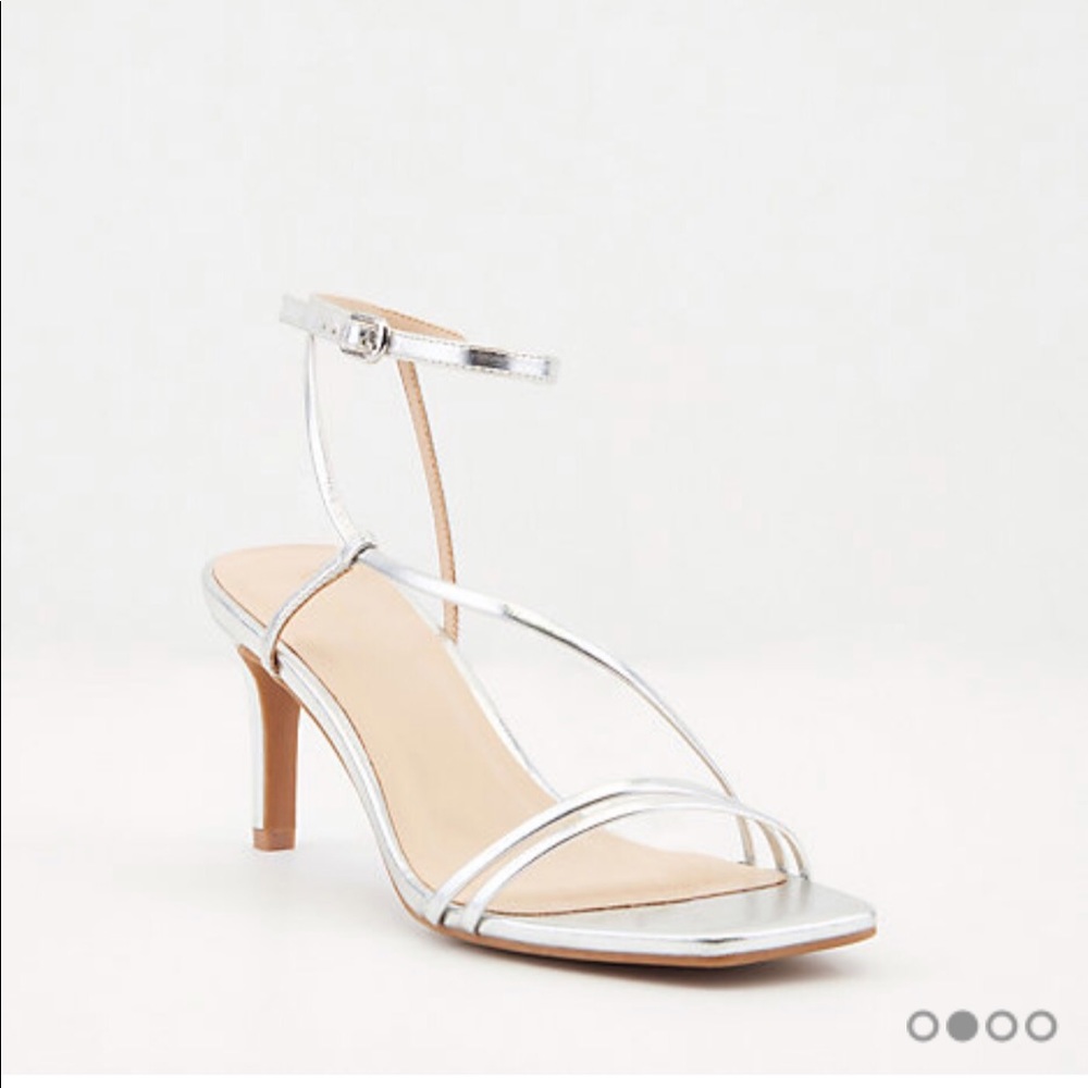 New with tags. Le Chateau silver heels. Never worn.” Size 10